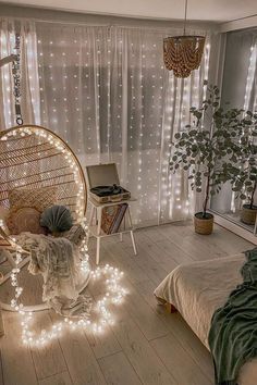 a bedroom with lights on the floor and a hanging chair