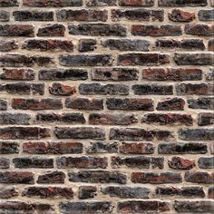 an old brick wall with red and gray bricks