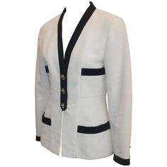 Chanel White 4-Pocket Jacket with Navy Trim & Camellia Buttons - 38 - 1980's. This jacket is in very good vintage condition with light wear. The 4 pockets are at the top and bottom of the fitted jacket. The beautiful buttons are lucite with gold camellias and are also along the sleeve cuffs. The fabric tag is gone, but the fabric seems to be cotton. Measurements: Bust- 35" Waist- 30" Hips- 37" Shoulder to Shoulder- 15" Sleeve Length- 22.5" Length- 25" Chanel White, Chanel Jacket, Fitted Jacket, Couture Vintage, Vintage Blazer, Pocket Jacket, Blazer Fashion, Jacket Design, Workout Jacket