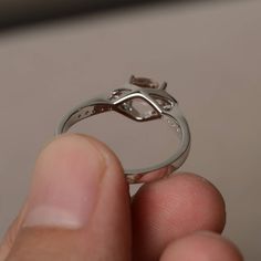 This is a gorgeous handmade creation. Its beauty is its simplicity & Elegance. The 5*7 mm oval shape faceted natural morganite is crafted in solid sterling silver and with rhodium plated. All item is sent in a beautiful gift box If you have any idea of design your ring,pls contact me directly. You can realize more lovely stuff clicking the link https://www.etsy.com/shop/knightjewelry?refshopsection_shophome_leftnav Please leave the correct address and you phone number for delivering successf Oval Diamond Cut Crystal Promise Ring, Sterling Silver Oval Topaz Ring With Diamond Cut, Oval Crystal Ring With Diamond Cut For Promise, Oval Diamond Cut Topaz Ring In Sterling Silver, Oval Sterling Silver Topaz Ring With Diamond Cut, Oval Morganite Solitaire Ring, Solitaire Morganite Oval Ring, Elegant Oval Solitaire Moonstone Ring, Classic Oval Morganite Ring