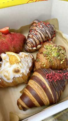 a box filled with different types of pastries