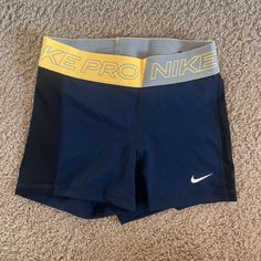 Multi Color Blue And Dark Blue Sides, Never Worn Nike Yellow Workout Shorts, Sporty Yellow Shorts For Training, Yellow Go-dry Sports Shorts, Nike Yellow Sport Bottoms, Yellow Moisture-wicking Short Bottoms, Sporty Yellow Athletic Shorts With Short Leg, Moisture-wicking Yellow Shorts, Stretch Yellow Nike Bottoms, Yellow Stretch Nike Bottoms