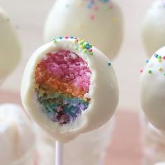 cake pops with rainbow frosting and sprinkles