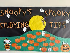 a bulletin board with pumpkins and ghost on it