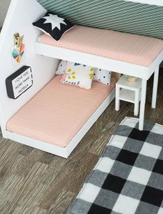 a dollhouse bed with the word pinterest on it's bottom shelf