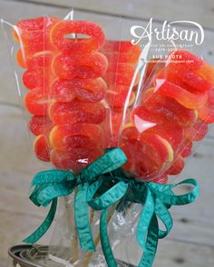 candies are wrapped in cellophane and tied with green ribbon