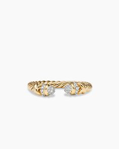 a gold ring with two diamonds on it