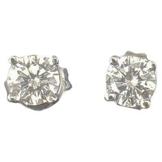 14 Karat White Gold Round Brilliant Diamond Stud Earrings- These sparkling stud earrings each feature one round brilliant cut diamond set in classic 14K white gold. Push back closures. Approximate total diamond weight: .50 ct. Diamond color: J-K Diamond clarity: SI1 Size: 4 mm Weight: 0.5 dwt./ 0.8 gr. Stamped: 14K Very good condition, professionally polished. Will come packaged in a gift box or pouch (when possible) and will be shipped U.S. Priority Mail Insured. DV06032417KCS