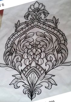 an intricately designed piece of paper with black ink