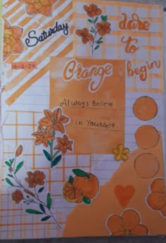 an orange card with flowers and words on it