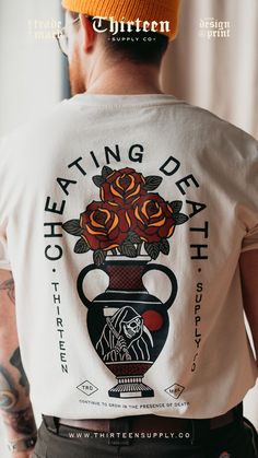 Cheating Death off-white unisex t-shirt featuring trendy design, perfect for casual wear and making a bold stat Tattoo Tshirt, Graphic Design Clothing, Traditional Vase, Awesome Shirt Designs, Cool Shirt Designs, Free T Shirt Design, Vans Outfit, Tattoo Clothing, Surrounded By Flowers