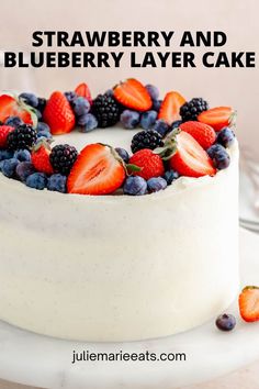 a white cake with berries and blueberries on top is sitting on a plate next to the words, strawberry and blueberry layer cake