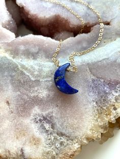 "Stunning 16mm blue Lapis Lazuli Crescent moon pendants have been made into a beautiful crystal necklace. In options of gold or silver this necklace is a show stopper. Perfect gift for that special someone in your life, they will cherish this handmade piece for years to come and will be a luxurious classic necklace to add to their wardrobe. This piece looks great worn alone or layered with other classy pieces. Handcrafted Lapis Lazuli Moon Pendant Necklace *Beautiful gift for her *High quality g Celestial Crystal Necklace With Moon Charm As Gift, Blue Crescent Gemstone Jewelry, Celestial Crescent Crystal Necklace For Gift, Blue Moon Charm Necklaces For Gifts, Crystal Necklace With Moon Charm As Gift, Blue Moon Charm Necklace For Gift, Blue Moon Charm Necklace Gift, Gift Crystal Necklace With Moon Charm, Blue Moon Charm Pendant Necklace