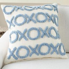 a close up of a pillow on a couch