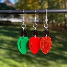 Pair of Christmas Light Bulb Dangle Earrings * Created from 3mm thick acrylic on a professional grade laser * Dangle version is about 2" long with hook * Stud version is about 1-1/4" long from top of bulb to bottom * Lightweight - each earring is less than an ounce * Super cute and perfect for Christmas! Christmas Light Bulbs, Light Earrings, Christmas Earrings, Fun Earrings, Unique Earrings, Christmas Lights, Light Bulb, Jewelry Earrings Dangle, Etsy Earrings