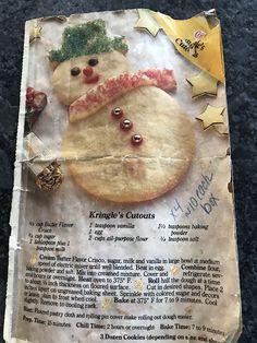 a close up of a cookie with a snowman on it's back cover