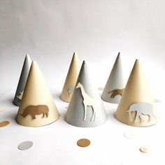 several paper hats with animals on them