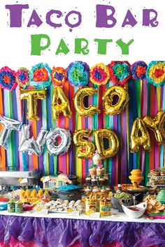 taco bar party with balloons and decorations