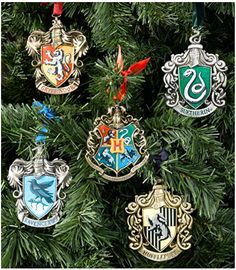 harry potter ornament ornaments hanging from a christmas tree in the shape of hogwart's crests