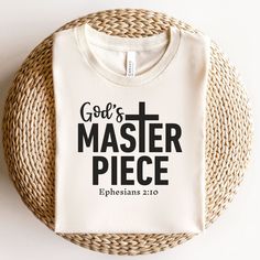 "This God's Masterpiece t-shirt is inspired by Ephesians 2:10 (NIV), which reads, \"For we are God's masterpiece. He has created us anew in Christ Jesus, so we can do the good things he planned for us long ago.\" By wearing this verse, you carry a reminder of your unique purpose and the love God has for you. by GracePhraseDesigns Brand: Bella + Canvas (manufactures all its products in the US and internationally in a humane, sustainable way and is part of the Fair Labor Association as well as Platinum WRAP certified)   Colors: Black  White  Heather Gray  Heather Navy  Natural Heather Mauve  Olive  Sizing: Unisex Adult Sizing (see size guide in photos) Material: 100% Airlume combed and ring-spun cotton Heather Colors are a cotton and polyester blend - 52% cotton, 48% polyester  Tear away lab Inspirational Lettering Crew Neck T-shirt, Inspirational Cotton Crew Neck T-shirt, Inspirational Crew Neck T-shirt With Lettering, Scripture Clothing, Gods Favourite Shirt, God's Favorite Shirt, Bible Shirts Aprojes, Scripture Shirt For Kids, Faith Based Shirts