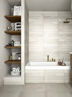 a bath room with a tub a sink and shelves