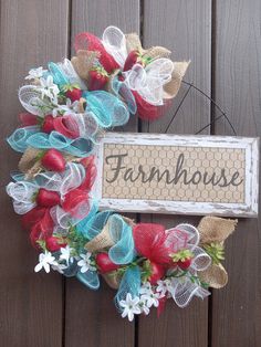 a wreath with the word farmhouse on it