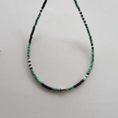 Elevate your summer bohemian style with this unique Mens Beaded Necklace! This Boho-inspired piece is perfect for adding a touch of flair to any outfit. Handcrafted with high-quality beads, this versatile Mens Necklace can also be styled as a beaded choker for a trendy look. Whether you're shopping for yourself or looking for beaded necklaces for women gifts, this necklace is sure to make a statement. Upgrade your accessory game with this one-of-a-kind beaded necklace today! Miyuki round 8/0 Pic Bohemian Black Beaded Necklaces For Summer, Bohemian Summer Necklace With Black Beads, Bohemian Black Beads Necklace For Summer, Bohemian Beaded Bracelets With Silver Beads For Meditation, Hippie Beaded Necklaces With Gemstone Beads For Beach, Bohemian Necklaces With Silver Beads For Beach, Bohemian Tiny Beads Bracelets For Meditation, Hippie Style Gemstone Beaded Necklaces For The Beach, Bohemian Silver Beaded Bracelets For Beach