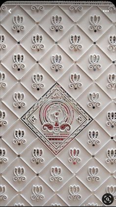 an intricately designed wallpaper with white and red designs