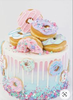 there are many donuts on top of this cake