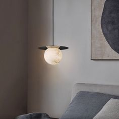 Add a modern touch to your bedroom with the Alabaster Sphere Pendant Light Above Bed. This stunning light is crafted from alabaster and hangs from a stylish metal handle. Enjoy the perfect amount of ambient lighting for a calming environment. Dimensions： Small: 10.2" D x 7.87" H(26cm D x 20cm H) Large: 15.7" D x 13.4" H(40cm D x 34cm H) 59"L cord will be provided, please contact us if you need more. Specification： Material: Metal, Natural Alabaster from Spain Finish: Brass (Optional: Black, Whit Light Above Bed, Lights Above Bed, Sphere Pendant Light, Calming Environment, Above Bed, Ceiling Light Fixtures, Ambient Lighting, 4 H, Warm White