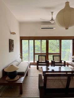 a living room filled with furniture and windows