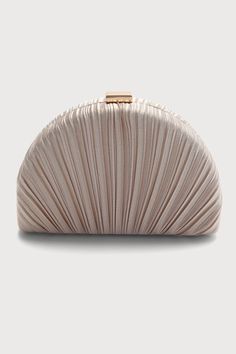 You'll be looking better than the best when you arrive dressed to the nines and holding the Lulus Pleat Perfection Champagne Pleated Hard Clutch! Sleek pleated fabric covers this study, hard-sided clutch that has an elegant half-circle silhouette and a gold-toned clasp. Roomy interior has accordion sides and a single sidewall pocket, perfect for those little party essentials. Removable gold shoulder chain. Clutch measures 8" wide, 5. 25" tall, and 1. 75" deep. Detachable 47" gold chain strap. Strap has a 23. 25" drop. Shell: 100% Polyester. Lining: 100% Polyester. Do Not Wash. Do Not Bleach. Do Not Dry Clean. Wipe With Damp Cloth. Imported. Lulus | Pleat Perfection Champagne Pleated Hard Clutch | 100% Polyester. Modern Purse, Circle Silhouette, Wedding Clutch Purse, Classic Purse, Party Essentials, Lulu Fashion, Wedding Clutch, Cute Handbags, Dressed To The Nines