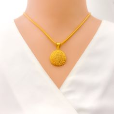 This striking 22k gold pendant, weighing 5.7 grams, features a charming bold design that exudes confidence and elegance. The yellow gold finish enhances its standout appeal, making it a perfect accessory for any occasion. With a length of 1.25 inches, this pendant is both eye-catching and versatile. Ideal for those who appreciate strong design elements and high-quality craftsmanship, this pendant can be paired with any chain of your choice. Its bold design and radiant gold make it a valuable and stylish addition to any jewelry collection. PRODUCT DETAILS Gold Purity(karat): 22k Gold Weight(grams): 5.7 Item Finish: Yellow Gold Pendant Length: 1.25" Chain: Not Included 22k Gold Necklace With Large Round Pendant, Yellow 22k Gold Necklace With Round Pendant, 22k Gold Yellow Necklace With Round Pendant, Bridal Jewelry Necklace, Precious Stones Rings, Diamond Pendant Sets, Modern Bracelets, Fancy Necklace, Fancy Rings