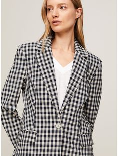 Tommy Hilfiger women's blazer. Formal styling takes a playful turn with this single-breasted blazer, cut to a slim fit from lightweight breathable seersucker.  Material: 50% Sustainable Modal (smd), 46% Cotton, 4% Elastane. Tommy Hilfiger Tailored Workwear Blazer, Tommy Hilfiger Notch Lapel Blazer For Work, Tommy Hilfiger Blazer With Notch Lapel For Work, Tommy Hilfiger Tailored Blazer For Work, Tommy Hilfiger Spring Workwear Blazer, Tommy Hilfiger Spring Blazer For Work, Classic Tommy Hilfiger Blazer For Workwear, Tommy Hilfiger Tailored Blazer With Notch Lapel, Tommy Hilfiger Tailored Single Breasted Blazer