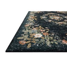 an area rug with flowers and leaves on the carpet, in black tones or colors