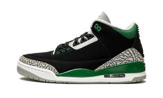 a black and green sneaker with white outs on the upper part of the shoe