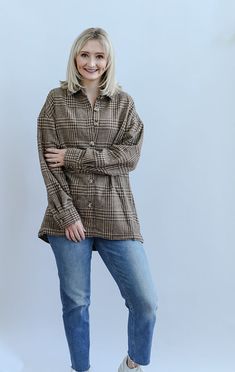 The Boone Day Plaid Brown Shacket is the ultimate cozy piece for your Fall and Winter wardrobe. The warm brown tones make this the perfect Fall festivity accessory! This shacket is detailed with long sleeves with buttons on the cuff, welt pockets, functional buttons, collar and a clean hem. Pair this shacket with your favorite mom jeans, boots and a basic white tee for a timeless and cozy look! - Runs true to size - Button down shacket - Long sleeves - Button on sleeve cuffs - Collar - Clean hem Brown Long-sleeved Outerwear With Button Closure, Casual Brown Outerwear With Buttoned Pockets, Brown Button-up Outerwear With Buttoned Pockets, Brown Workwear Tops With Button Closure, Brown Button Closure Tops For Work, Brown Tops With Button Closure For Work, Brown Collared Outerwear With Buttons, Brown Collared Outerwear With Button Closure, Plaid Long Sleeve Outerwear With Button Closure