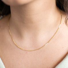 "14K Gold Filled Bar Chain Necklace from our Memoirs Made collection. A classic jewelry staple that is timeless and chic, and wonderfully lustrous in 14K gold filled. Uncomplicated on its own, we also love the look of it layered with other gold chains, pearls, and beaded necklaces to achieve that Parisian Girl look. Either way, you will find unlimited options to style this beautiful chain. CHAIN DETAILS ⚬ 14k gold-filled bar chain or 925 Sterling Silver ⚬ Bars measure 1.1mm x 10.25mm. ⚬ Chain in Classic Yellow Gold Bar Necklace With Cable Chain, Adjustable Gold-plated Delicate Chain Layered Necklace, Elegant 14k Gold-filled Necklaces With Paperclip Chain, Elegant 14k Gold-filled Necklace With Paperclip Chain, Gold-plated Rectangular Chain Necklace With Adjustable Chain, Chain Layering, Jewelry Staples, Silver Bars, Classic Jewelry