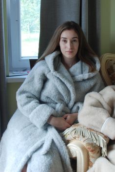 Bathrobe made of 100% wool knitwear that does not cause skin irritation. This classic model for MEN and WOMEN is finished with a classic model with hood and pockets, has a belt and two side pockets located in the side seams.  Through heating and gentle massage, it reduces muscle tension, relieves pain of rheumatic origin. The highest class of finish and detailed refinement will certainly give you maximum comfort with your morning coffee or evening tea.  size    S        /  36 EU       /   6  US   /                          M       /  38 EU       /   8  US   /                       L         / 40  EU      /  10  US  /                          XL       / 42 EU        /   12 US   /                    XXL    /  44 EU       /  14 US   /                   XXXL  / 46 EU       /   16 US   / Super Soft Outerwear For Winter Lounging, Super Soft Outerwear For Lounging In Winter, Cozy Hooded Robe For Winter, Cozy Hooded Winter Robe, Hooded Winter Robe For Sleep, Winter Hooded Lounging Robe, Cozy Hooded Robe For Loungewear, Cozy Long Sleeve Winter Robe, Long Sleeve Winter Sleep Robe