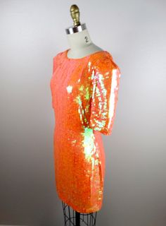 "An absolutely breathtaking color! This beauty is fully embellished with iridescent orange sequins and in perfect condition! Measurements: Bust - 32/34\" Waist - 27\" Hips - 36\" Dress Length - 32\" This amazing dress comes from a pet-free and smoke-free home. If you would like more info or have any questions, please ask!" Orange Evening Dress For Party Season, Elegant Orange Sequin Dress, Glamorous Orange Wedding Dress, Embellished Orange Evening Dresses, Glamorous Orange Evening Dress, Glamorous Orange Dress, Orange Cocktail Dress For Party Season, Orange Sequined Dress For Party, Orange Sequined Summer Dress