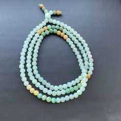 Ice Green Jade Beaded Necklace, Jade Beaded Necklace, Natural Grade A burmese Jadeite Jade(翡翠珠链） ‼️Has Jade Root  Jade Measurement: Approximately  Shape and Cut: spherical Color: Ice Green, Apple Green, Yellow ❤️Jade is an important part of Chinese traditional culture, the carrier of Chinese culture, and the inheritance of China's five-thousand-year civilization. In the eyes of the Chinese people, jade is not only a stone, but a spiritual thing that grows between heaven and earth, absorbs the spirit of heaven and earth, precipitates the vicissitudes of history, and integrates heaven and earth with history. Jade culture has a long history in China. Jade culture came into being in the early Neolithic Age and has a history of several thousand years. It symbolized beauty and purity, and becaus Traditional Jade Beaded Jewelry, Traditional Jade Beaded Necklaces, Green Gemstone Beads Mala, White Jade Round Beads Jewelry, Hand-strung Jade Beaded Necklaces With Round Beads, Traditional Hand-strung Jade Beaded Necklace, Green Hand-strung Mala, Green Hand-strung Mala With Round Beads, Hand-strung Jade Necklaces With Round Beads