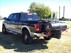 the truck is parked on the grass in the field