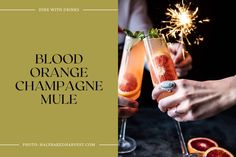 blood orange champagne mules with sparklers on the top and two people holding glasses