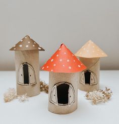 three little houses made out of toilet paper