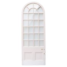 a white door with an arched window on the top and bottom side, against a white background