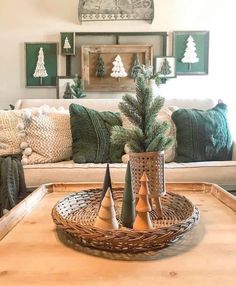 a living room filled with lots of furniture and decor on top of a wooden table