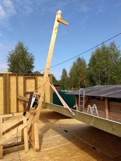 a wooden structure is being constructed on the ground