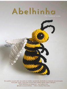 a crocheted bee with a white and black stripe