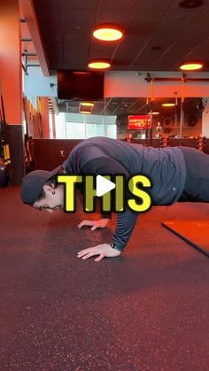 a man is doing a handstand in the middle of an orange floor with his head down