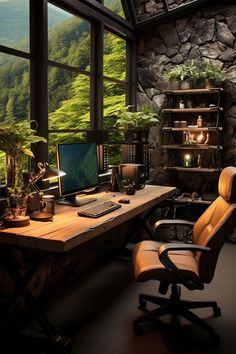 a desk with a computer and chair in front of a large window overlooking the mountains